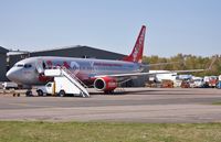 G-GDFC @ EGHH - Paint repairs just carried out to reported belly scratches - by John Coates