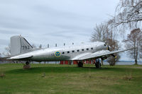 79002 @ N.A. - Douglas Tp79 of the Swedish Air Force. It is located near the old parachutist school at the Karlsborg fortress at lake Vättern (in background) and maintained by the Fallskärmsjägarklubben. - by Henk van Capelle