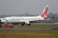 VH-YIL @ YSSY - taxiing from 16R - by Bill Mallinson