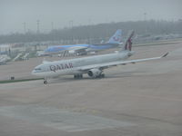 A7-AEN @ EGCC - aircaft now free from the tug taxing out from T2 for take offphoto taken from the top floor of the carpark.