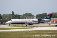 N427ZW @ KSRQ - US Air Flight 4078 operated by Air Wisconsin (N427ZW) arrives at Sarasota-Bradenton International Airport following a flight from Reagan National Airport - by Donten Photography