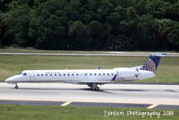 N14204 @ KTPA - United Flight 4318 operated by Express Jet (N14204) arrives at Tampa International Airport following a flight from Cleveland-Hopkins International Airport - by Donten Photography