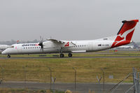 VH-QOM @ YSSY - taxiing to 34R - by Bill Mallinson