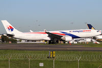 9M-MTK @ YSSY - away to KUL - by Bill Mallinson