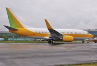 VQ-BBS @ EGHH - Being towed to European ramp - by John Coates