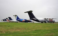 G-CGYR @ EGBP - Line of stored 146s include G-ZAPO, OH-SAJ, G-CFSM, OH-SAK etc - by John Coates