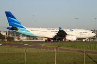 PK-GPL @ YSSY - taxiing off 34L - by Bill Mallinson