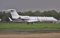 N144KK @ EGHH - European parking lot. - by John Coates