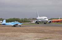 G-OBAL @ EGHH - Watching N565EL depart on delivery to USA - by John Coates