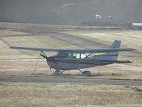ZK-EOS @ NZNE - At north shore with taxiway in background - by magnaman