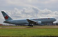 C-FMWV @ EGLL - Touchdown - by John Coates