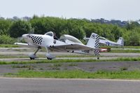 G-CIBM @ EGFH - Raven 4 of Team Raven returning from formation aerobatics practice.
Raven 5 (G-CDPJ) in the background. - by Roger Winser