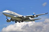 9K-ADE @ EGLL - Approach 27L - by John Coates