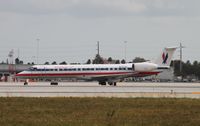 N655AE @ KMIA - EMB-145LR
