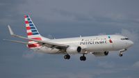 N924NN @ MIA - American 737-800 landing with storm clouds