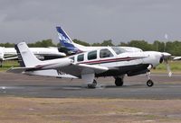 N1136Y @ EGHH - Taxiing to depart - by John Coates