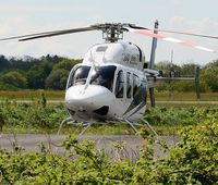 N429MD @ EGFH - Visiting Bell 429 Global Ranger EMS company demonstrator on the apron at the Wales Air Ambulance base at Swansea Airport. - by Roger Winser