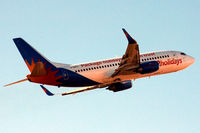 G-GDFL @ EGNH - Take off for Tenerife South with the setting sun lighting up the scene. - by Clive Pattle