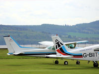 N5526R @ EGPN - A Cessna N5526R from afar on the GA park next to a based Cherokee G-BIIT - by Clive Pattle