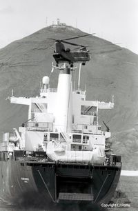 ZA707 @ FHAW - coded 'BP' of 18 Sqn RAF pictured hovering over the ill-fated MV Atlantic Conveyor off Ascension Island enroute to the Falklands War. n.b the cocooned Chinook on the aft of the ship. It along with other helis were lost when the ship sank after an exocet a - by Clive Pattle