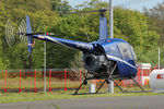 G-MOGY @ EGNT - Robinson R22 Beta, Newcastle Airport, May 2014. - by Malcolm Clarke