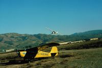 N3288E @ Q59 - 88E when it was based at the Fremont Airport. Taylorcraft 961 is overhead turning crosswind after takeoff in 1976.