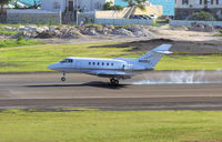 N812GJ @ TNCM - N812GJ