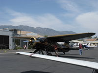 N69357 @ SZP - 1944 Stinson V-77 by Vultee Aircraft, Lycoming R-680-13 per engine data plate, 9 cylinder 300 Hp radial in smooth cowl-no bumps, spotting to busy fuel dock - by Doug Robertson
