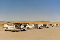 N3368E @ TCY - 68E on taildragger row at the Tracy airport in 1987.
