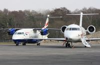 OY-NCD @ EGHH - At JETS with G-LWDC - by John Coates