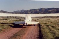 N9078E - The advantage of a tailwheel. 78E in central Calif. in 2001. This area has a lot of roads like this that can be safely landed on.This is why tailwheels are so neat!