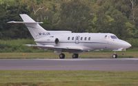 M-ALUN @ EGHH - Taxiing to depart - by John Coates