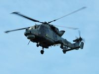 ZZ375 @ EGFH - Royal Navy Wildcat helicopter operated by 700W NAS flying over Swansea Airport whilst leading Talon Formation with ZZ380. Returning to thier base at HMS Heron (RNAS Yeovilton). - by Roger Winser