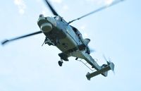 ZZ380 @ EGFH - Royal Navy Wildcat helicopter operated by 700W NAS flying over Swansea Airport as part of Talon Formation led by ZZ375. Heading for thier base at HMS Heron (RNAS Yeovilton). - by Roger Winser