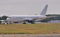 ZS-DJI @ EGHH - Being towed to parking - by John Coates