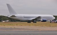 ZS-DJI @ EGHH - Parked at its new home - by John Coates