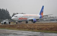 G-GDFO @ EGHH - Departs in snowstorm after repaint - by John Coates