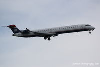 N913FJ @ KSRQ - US Air Flight 2886 operated by Mesa (N913FJ) arrives at Sarasota-Bradenton International Airport following a flight from Charlotte-Dougalas International Airport - by Donten Photography