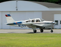 N17818 @ 12N - A nice 1977 single-tail Beech Bonanza swoops in at Aeroflex Andover. - by Daniel L. Berek