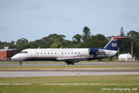 N436AW @ KSRQ - US Air Flight 4023 operated by Air Wisconsin (N436AW) arrives at Sarasota-Bradenton International Airport following a flight from Reagan National Airport - by Donten Photography