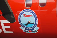 C-GSUR - Close up of emblem on fuselage.