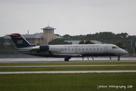 N468AW @ KSRQ - US Air Flight 4023 operated by Air Wisconsin (N468AW) arrives at Sarasota-Bradenton International Airport following a flight from Reagan National Airport - by Donten Photography