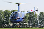 G-BSCE @ EGBR - Robinson R22 Beta at The Real Aeroplane Club's Biplane and Open Cockpit Fly-In, Breighton Airfield, June 1st 2014. - by Malcolm Clarke