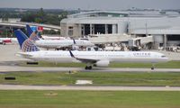 N75854 @ TPA - United 757-300 carrying the Tampa Bay Buccaneers - by Florida Metal