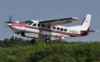 G-EELS @ EGFH - Visiting Grand Caravan fitted with a TV camera departing Runway 22 to cover a golf tournament.. - by Roger Winser