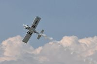 G-MAXV @ EGFH - Raven 1 of Team Raven breaks right before landing at base. In recently applied full Team Raven colour scheme. - by Roger Winser