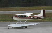 N8702Z @ CYXY - On amphibious floats, taxiing for takeoff at Whitehorse, Yukon. - by Murray Lundberg