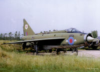 XM180 @ EDUO - Scanned from a print, Lightning F.1A XM180 on the dump at RAF Gutersloh, (EDUO) in September 1979 having finished decoy duties as 8424M - Still alive in 1982 ! - by Clive Pattle