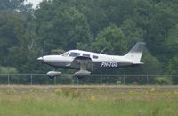 PH-TGL @ EHGG - A few meters above runway 05 for landing.
