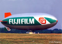 D-LDFQ @ EGTF - Scanned from print. Spotted this (could hardly miss it) at Fairoaks airfield EGTF in Jul '96. It was being used to overfly nearby London City on regular advertising sorties. - by Clive Pattle